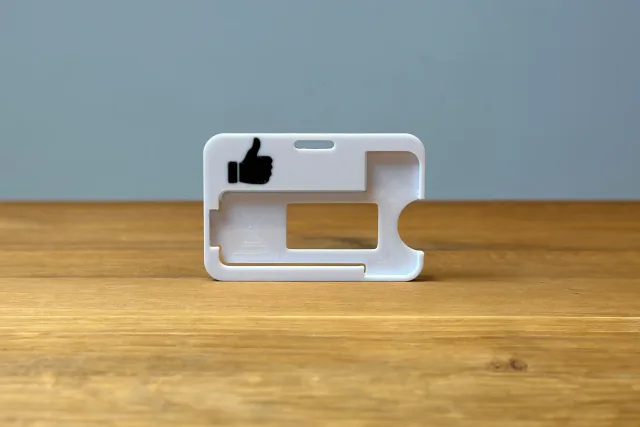 Thumb up carrier frame
