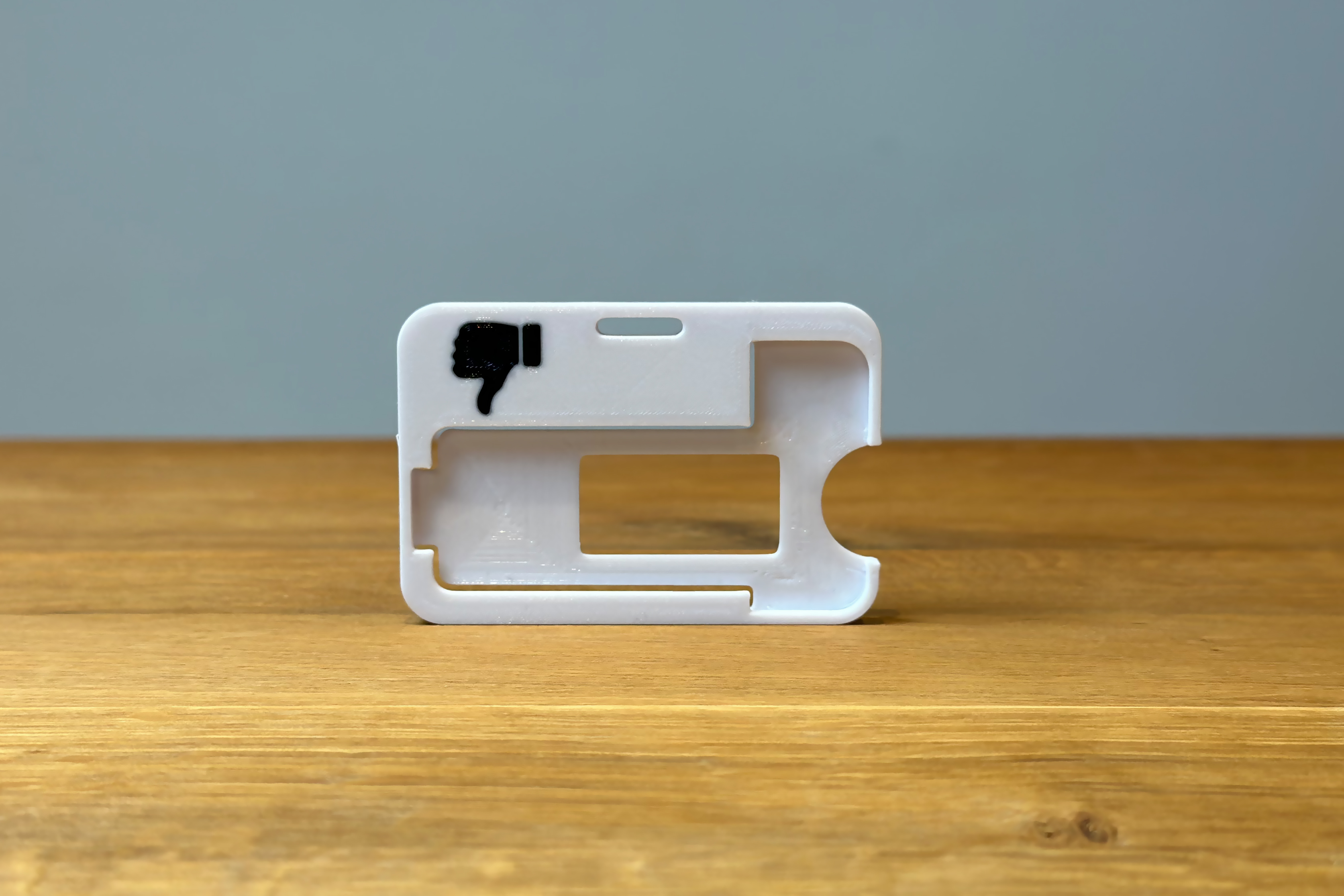 Thumb down carrier frame