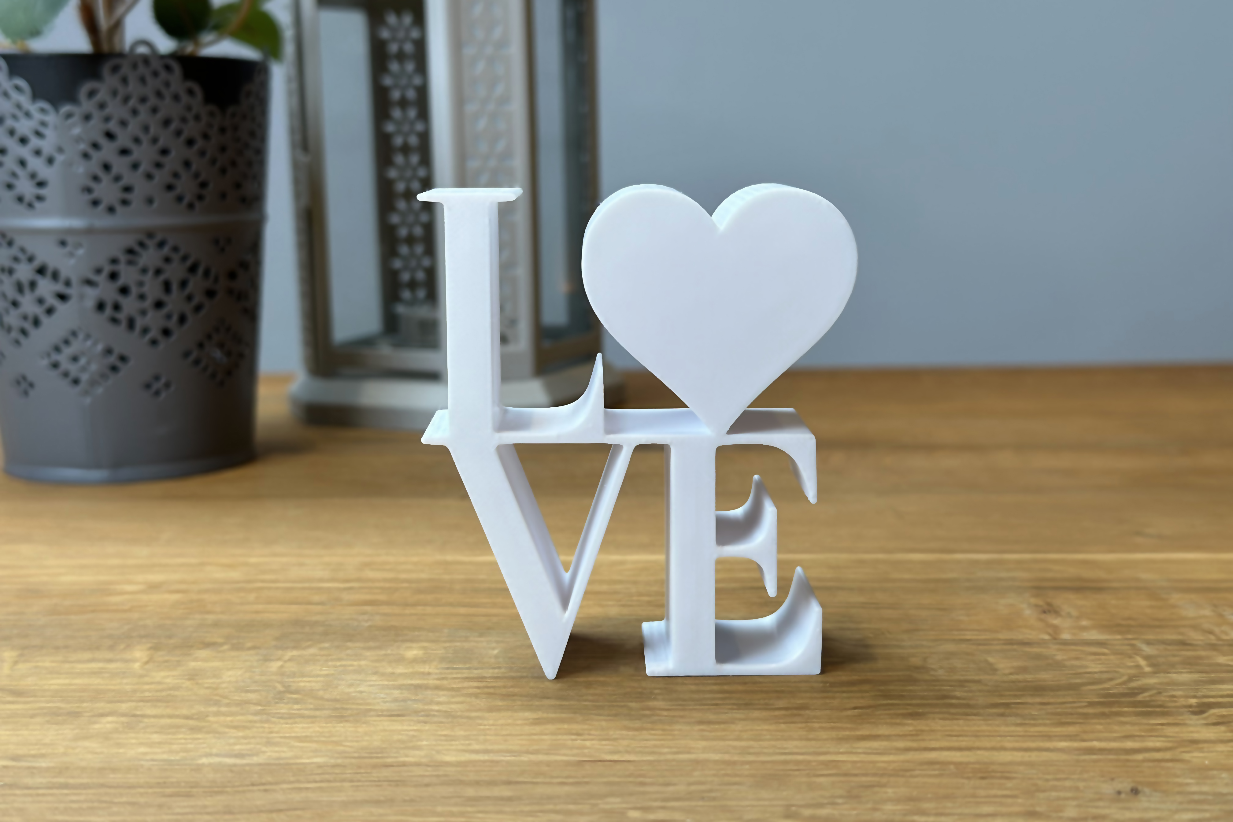 Stylish decorative lettering as Love with a heart for your home or as a gift for loved ones.
